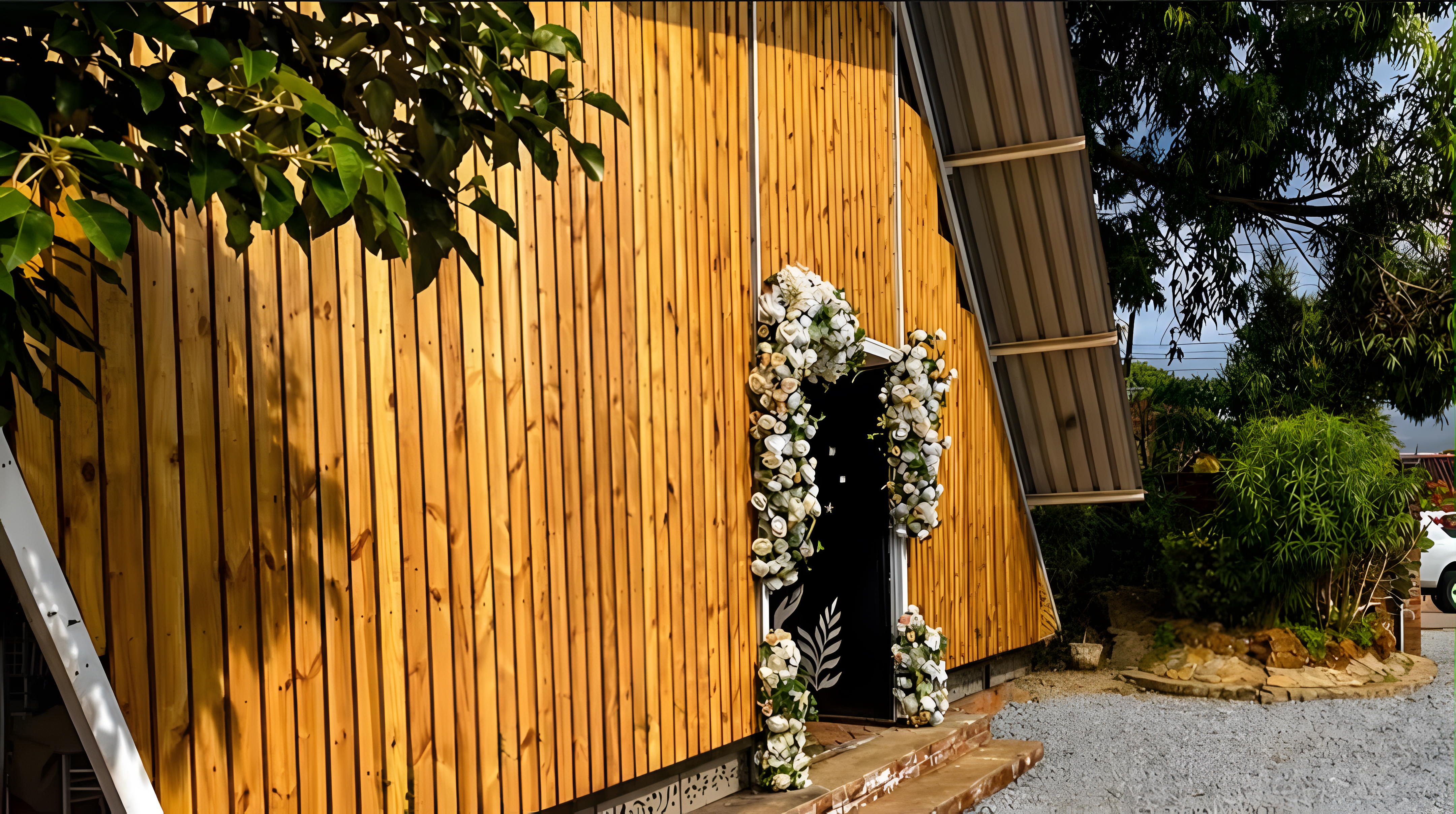 Venue exterior with floral arch