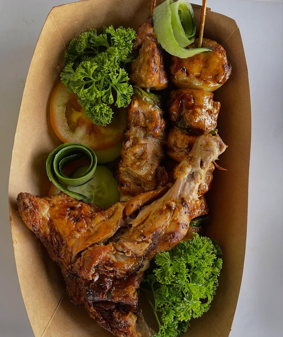 Grilled skewers and chicken wings beautifully plated